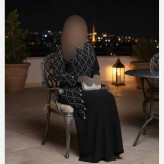 پیراهن مجلسی زنانه مدل تندیس جنس کرپ دالقیچ مشکی با خرجکار نگین و مروارید سایز 38 تا 60