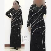 پیراهن مجلسی زنانه مدل غزل جنس کرپ دالقیچ مشکی با خرجکار نگین و مروارید سایز 38 تا 60